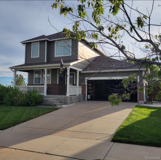 view of front of property with an attached garage, covered porch, brick siding, driveway, and a front yard