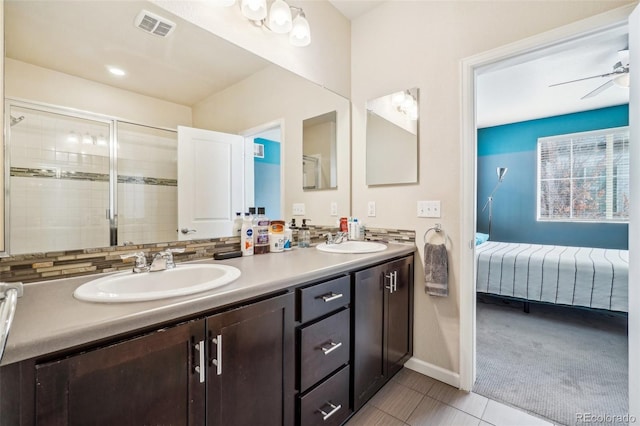 full bathroom featuring visible vents, a sink, ensuite bath, and double vanity