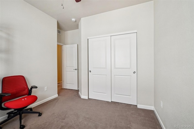 interior space with visible vents, ceiling fan, and baseboards