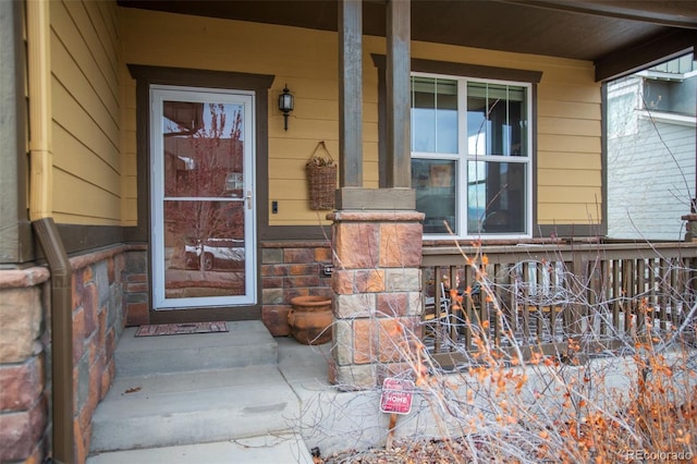 property entrance featuring covered porch