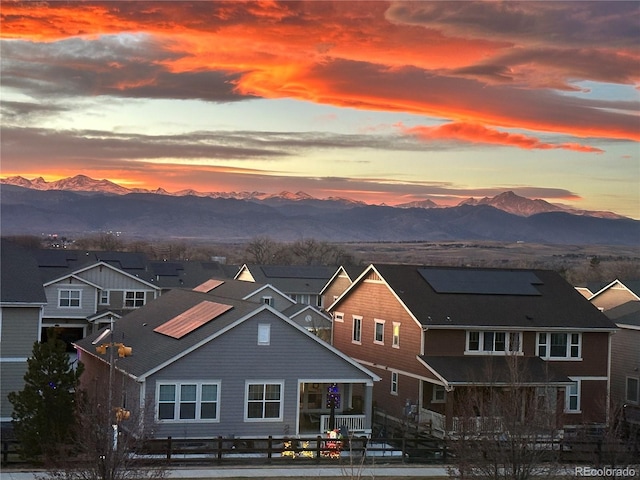 back house at dusk featuring a mountain view