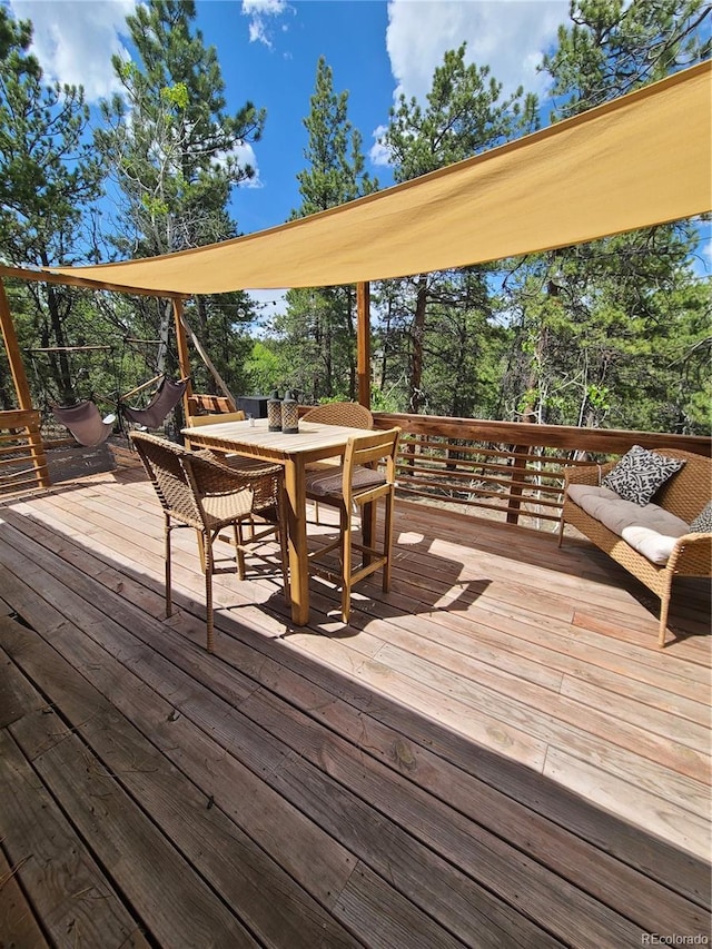 148 Wakonda Ln, Hartsel, CO 80449 - wooden deck featuring outdoor dining area