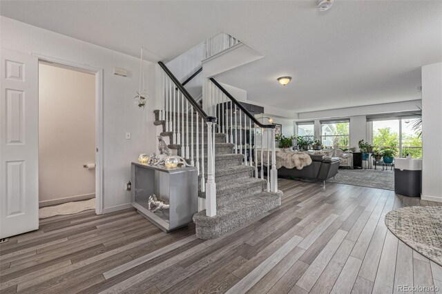 6260 Everett Ct Unit D, Arvada, CO 80004 - stairs with wood finished floors and baseboards