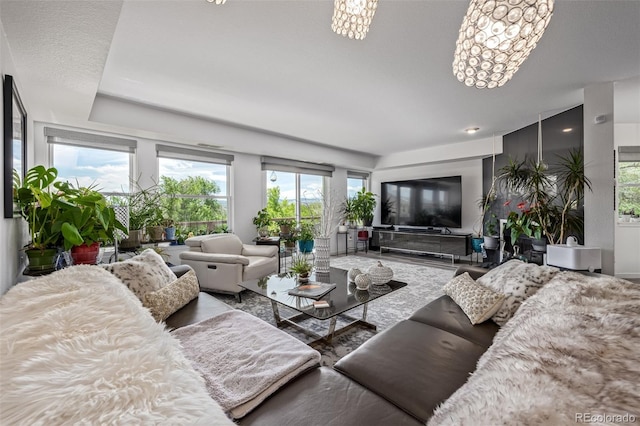 6260 Everett Ct Unit D, Arvada, CO 80004 - living room featuring plenty of natural light and a chandelier