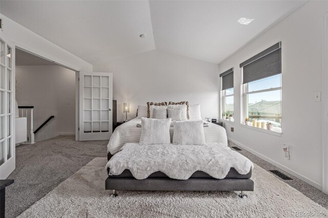 6260 Everett Ct Unit D, Arvada, CO 80004 - carpeted bedroom with vaulted ceiling and baseboards