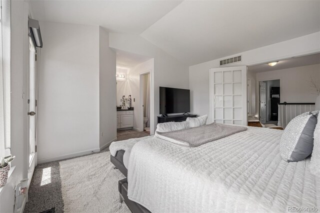 6260 Everett Ct Unit D, Arvada, CO 80004 - carpeted bedroom with lofted ceiling and ensuite bath
