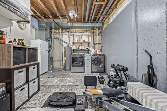 6260 Everett Ct Unit D, Arvada, CO 80004 - unfinished below grade area featuring separate washer and dryer, water heater, and freestanding refrigerator