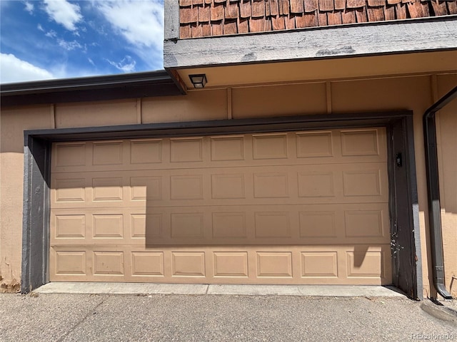 1203 S Crystal Way, Aurora, CO 80012 - garage with aphalt driveway
