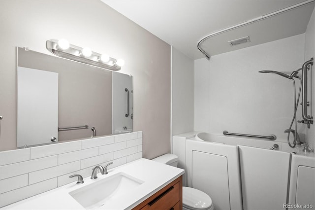 bathroom featuring shower / tub combination, toilet, vanity, visible vents, and backsplash