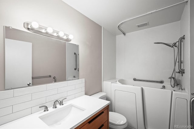 full bath with visible vents, vanity, backsplash, and toilet