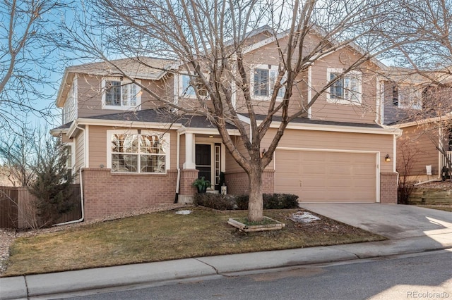 view of front of house with a garage and a front yard