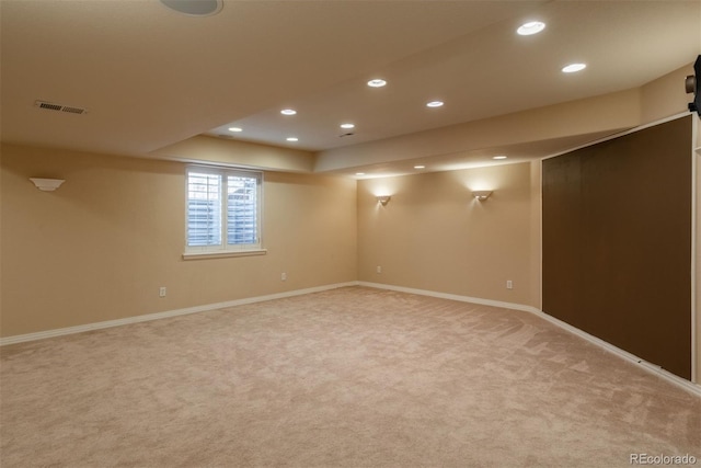 basement with light colored carpet