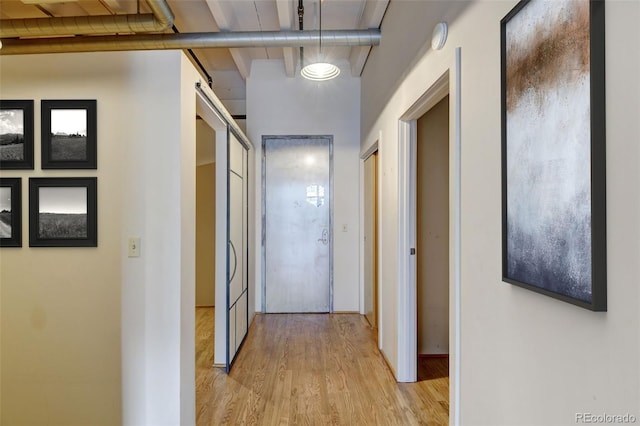 hall with light hardwood / wood-style flooring