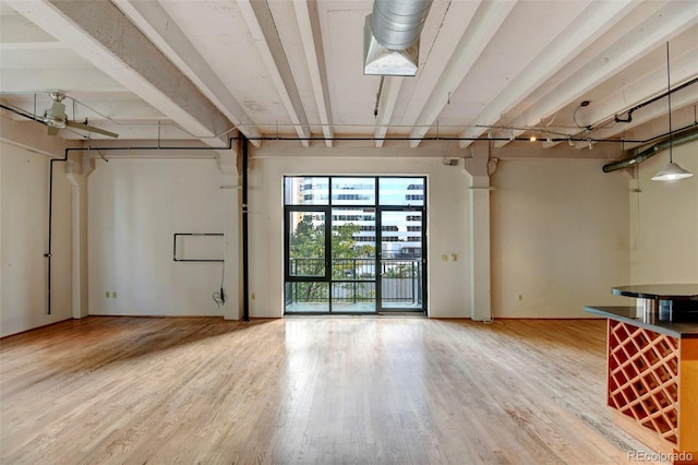 below grade area with light wood-style floors