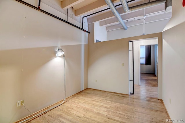 spare room featuring wood finished floors