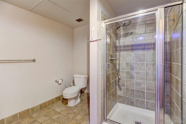 bathroom with a shower stall, tile patterned flooring, visible vents, and toilet