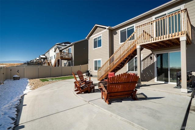 rear view of house featuring a patio area and a deck