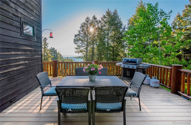 13416 Kuehster Rd, Littleton, CO 80127 - deck featuring a grill and outdoor dining space