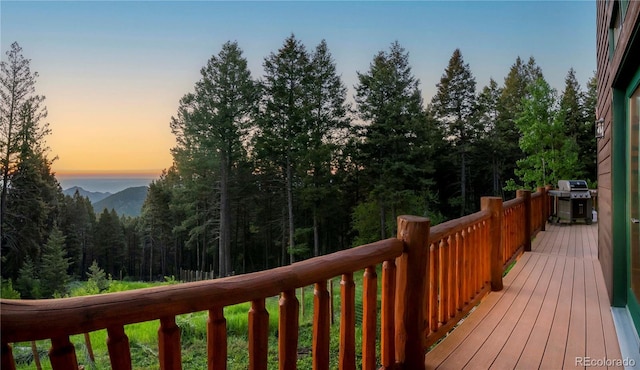 13416 Kuehster Rd, Littleton, CO 80127 - wooden terrace with grilling area and a forest view
