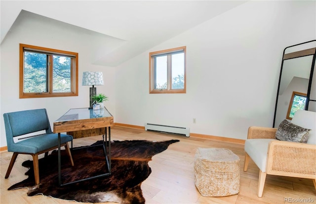 13416 Kuehster Rd, Littleton, CO 80127 - office area featuring a baseboard heating unit, plenty of natural light, light wood finished floors, and lofted ceiling