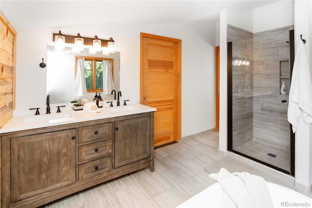 13416 Kuehster Rd, Littleton, CO 80127 - bathroom featuring a shower stall and double vanity