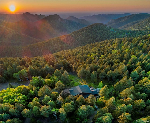 13416 Kuehster Rd, Littleton, CO 80127 - aerial view at dusk of a forest view and a mountain view