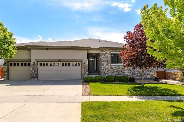 6265 S Ider Way, Aurora, CO 80016 - prairie-style home with stone siding, stucco siding, an attached garage, and concrete driveway