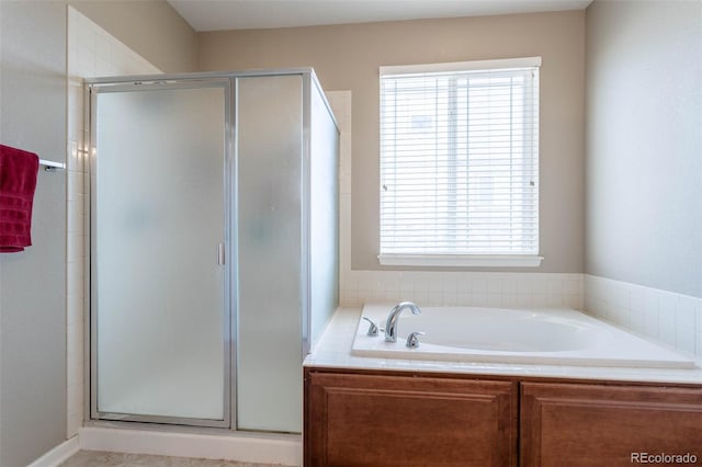 6265 S Ider Way, Aurora, CO 80016 - bathroom featuring a stall shower, healthy amount of natural light, and a garden tub