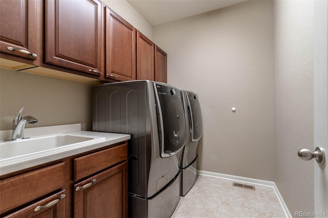 6265 S Ider Way, Aurora, CO 80016 - washroom with cabinet space, independent washer and dryer, and baseboards
