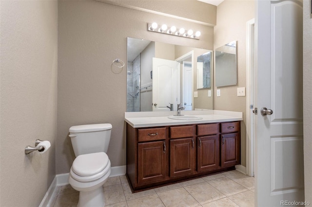 6265 S Ider Way, Aurora, CO 80016 - bathroom featuring toilet, vanity, tile patterned floors, and baseboards