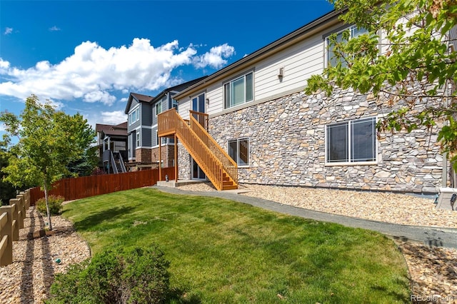 6265 S Ider Way, Aurora, CO 80016 - rear view of house with stone siding and stairway
