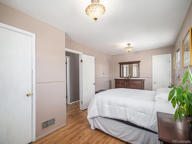 bedroom with light hardwood / wood-style floors