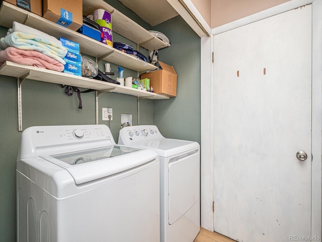 clothes washing area featuring washer and dryer