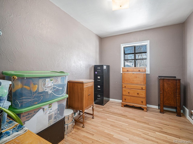 office area with light hardwood / wood-style flooring