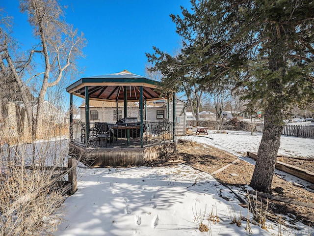 snowy yard with a gazebo