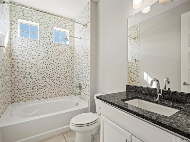 bathroom with toilet, vanity, shower / washtub combination, and tile patterned floors