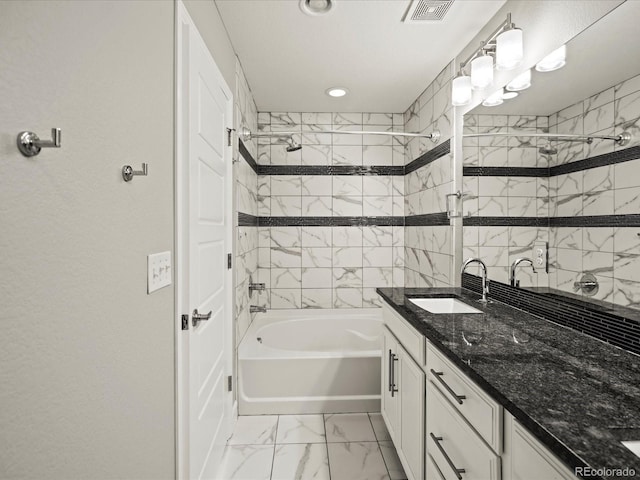 full bathroom featuring  shower combination, marble finish floor, visible vents, and vanity