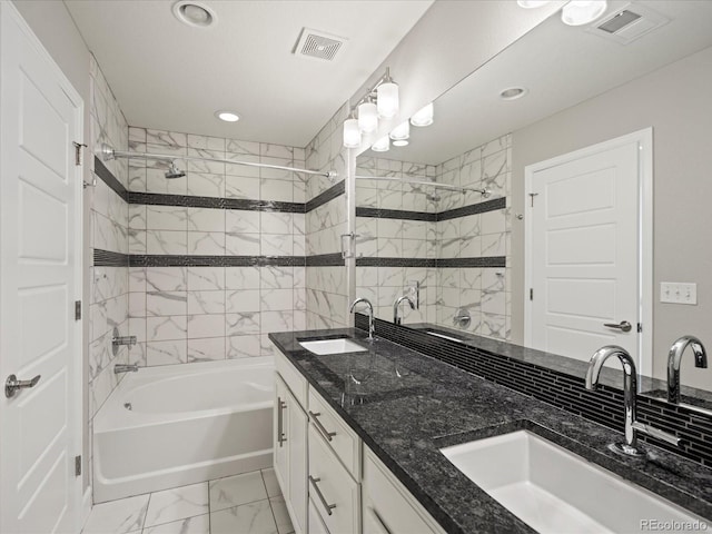 full bath with marble finish floor, visible vents, a sink, and shower / bathtub combination