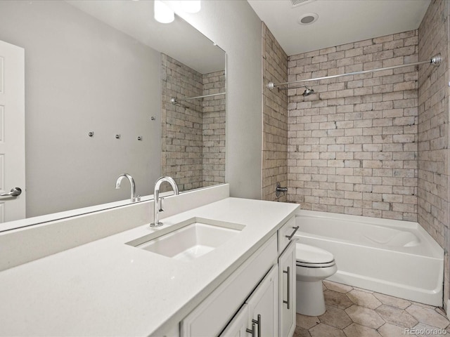 bathroom with tile patterned flooring, bathtub / shower combination, vanity, and toilet