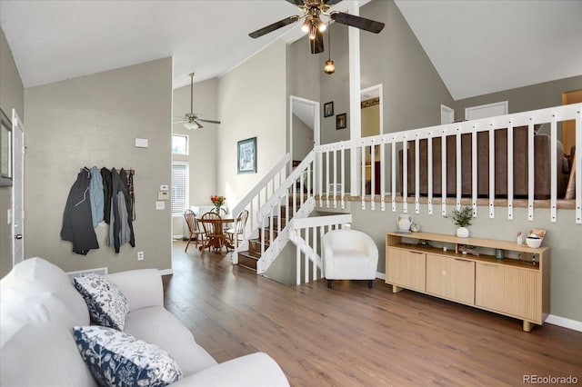 3853 S Genoa Ct Unit D, Aurora, CO 80013 - living area with ceiling fan, high vaulted ceiling, wood finished floors, stairs, and baseboards