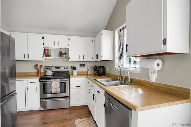 3853 S Genoa Ct Unit D, Aurora, CO 80013 - kitchen with stainless steel appliances, a sink, light countertops, dark wood-style flooring, and white cabinetry
