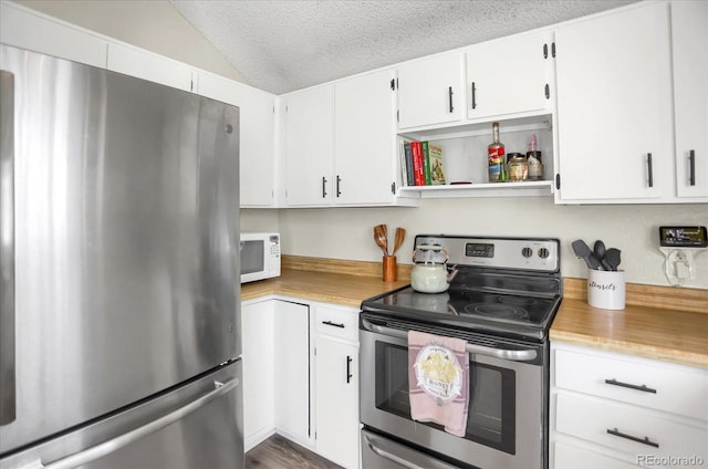 3853 S Genoa Ct Unit D, Aurora, CO 80013 - kitchen with stainless steel appliances, light countertops, vaulted ceiling, white cabinetry, and a textured ceiling
