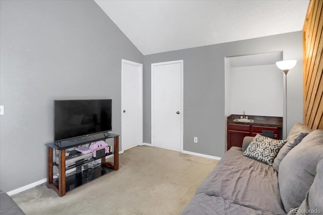 3853 S Genoa Ct Unit D, Aurora, CO 80013 - carpeted living area with a sink, vaulted ceiling, and baseboards