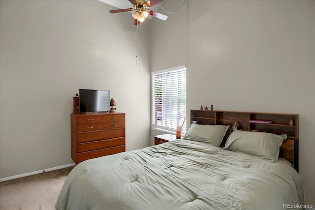 3853 S Genoa Ct Unit D, Aurora, CO 80013 - carpeted bedroom featuring a high ceiling, baseboards, and a ceiling fan