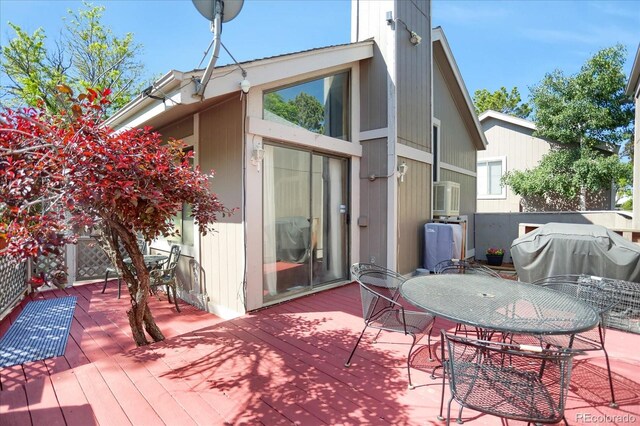 3853 S Genoa Ct Unit D, Aurora, CO 80013 - wooden terrace featuring outdoor dining area