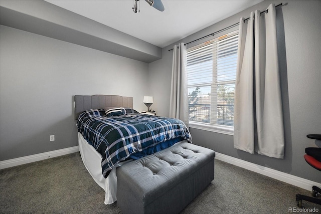 bedroom with dark colored carpet