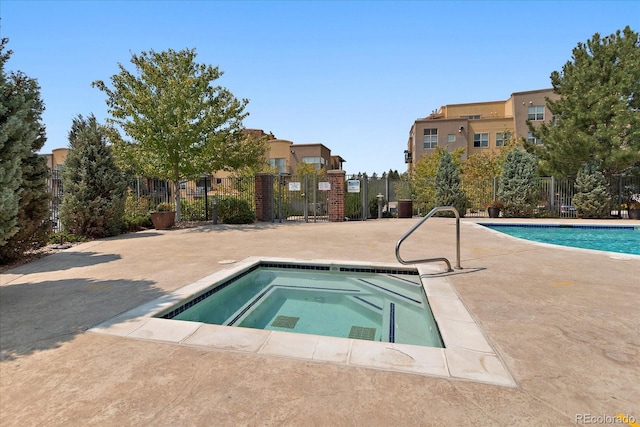 view of pool featuring a hot tub