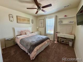bedroom featuring carpet flooring, baseboards, and a ceiling fan