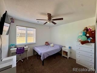 bedroom with carpet floors and a ceiling fan