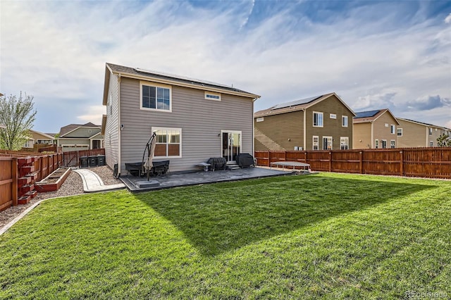 rear view of property featuring a patio and a residential view